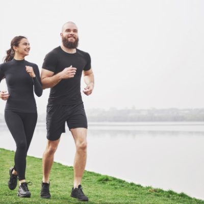 couple-jogging-running-outdoors-park-near-water-young-bearded-man-woman-exercising-together-morning_146671-14833