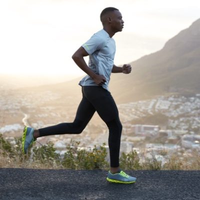 outdoor-shot-active-dark-skinned-man-running-morning-has-regular-trainings-dressed-tracksuit-comfortable-sneakers-concentrated-into-distance-sees-finish-far-away_273609-29401